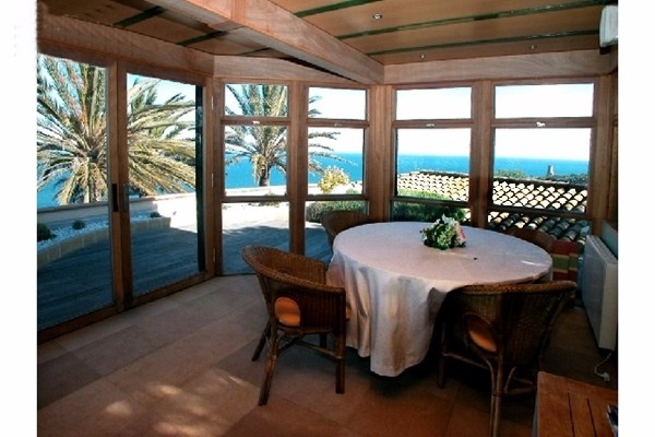 The pleasant dining-room with huge windows and views to the paradise-like nature