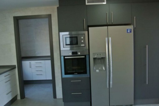 Kitchen with side by side fridge